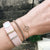 original premium metal Model wearing Fitbit Alta with Classic Stack accessory - original premium metal