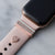 Gold Apple Watch with pink Sport band and rose gold glam stack with engraved gold 3mm ring