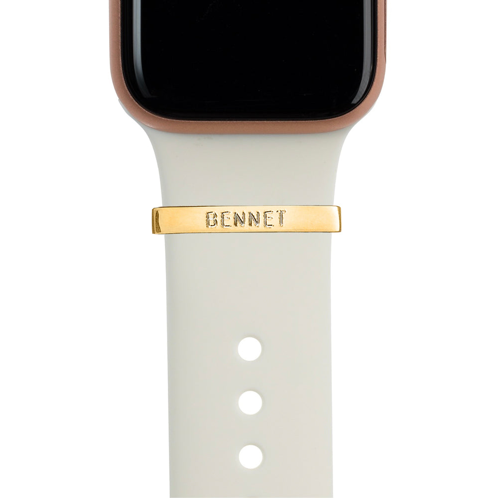 Gold Apple Watch with white Sport band and polished gold bytten 3mm engraved ring charm accessory