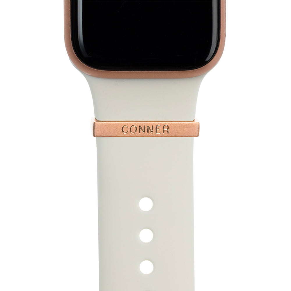 Gold Apple Watch with white Sport band and satin rose gold bytten 3mm engraved ring charm accessory